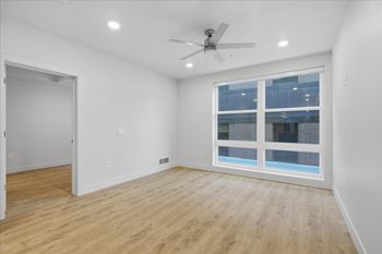 Room with large window and ceiling fan1